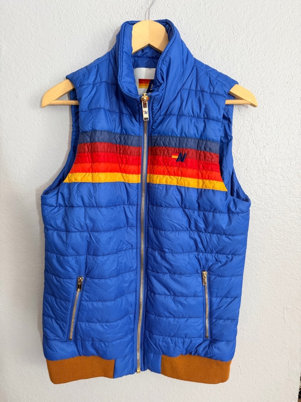 Aviator Nation Blue Puffer Jacket with Rainbow Chest Stripes